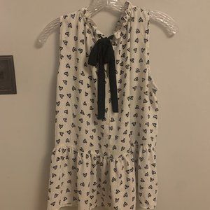 White top with black heart pattern